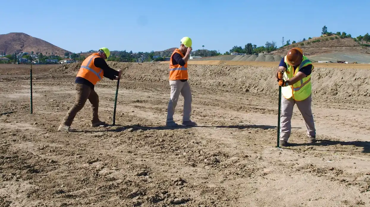 installing traditional t post on a construction site